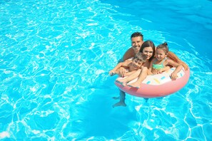 Guests can enjoy a refreshing swim in the pool, surrounded by a calm atmosphere.