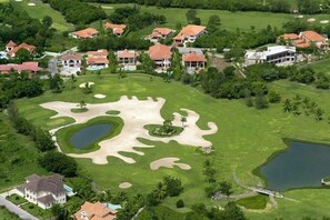 Golfers can enjoy a well-maintained fairway, sand bunkers, and a water hazard on this course.