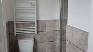 Standard Studio | Bathroom | Shower, hair dryer, towels, soap
