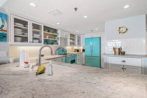 Fridge, microwave, oven, stovetop - Welcome to this stylish 2BR/2BA condo in Chadham By the Sea on a peaceful no-drive beach. Enjoy sweeping ocean views from the open living, dining, and kitchen area, all designed to showcase the scenery, with a calming beach-themed interior. (New Smyrna Beach)