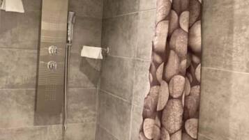 Shower, towels, soap, toilet paper