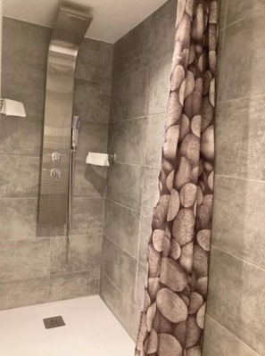 Shower, towels, soap, toilet paper