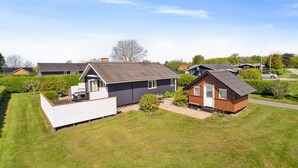 A residential area with houses, a grassy lawn, and a clear sky. - "Hira" - 200m from the sea by Interhome (Egernsund)