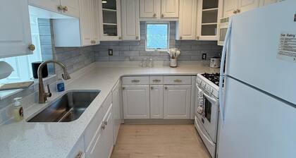Freshly renovated waterfront retreat in Warwick Cove! This cozy 1-bedroom features a loft-style king bed, queen sleeper sofa, spacious deck, fenced yard, and open backyard leading to the water - perfect for a relaxing coastal escape.
