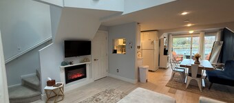 Freshly renovated waterfront retreat in Warwick Cove! This cozy 1-bedroom features a loft-style king bed, queen sleeper sofa, spacious deck, fenced yard, and open backyard leading to the  water - perfect for a relaxing coastal escape.