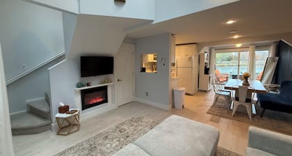 Freshly renovated waterfront retreat in Warwick Cove! This cozy 1-bedroom features a loft-style king bed, queen sleeper sofa, spacious deck, fenced yard, and open backyard leading to the water - perfect for a relaxing coastal escape.