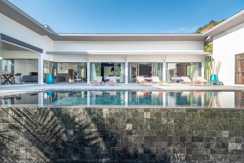 Elegant 4-bedroom villa with private pool, waterfall showers, and garden