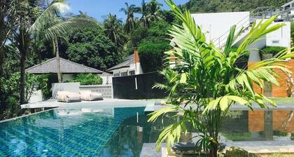 Tropical retreat with air-conditioned bedroom, pool, and bar