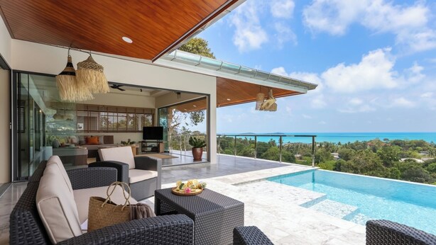 A modern outdoor living area with wicker furniture, a pool, and a view of the ocean. - Stunning 3-bedroom villa in Chaweng with private pool and sea views, near beach (Koh Samui)
