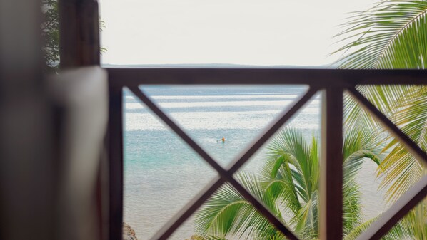 Chambre Quadruple Confort, vue plage | Coin séjour