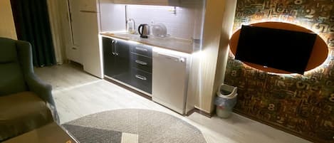 Standard Apartment, Balcony, City View | Living area | 31-inch LCD TV with satellite channels