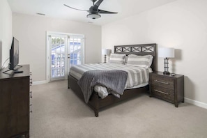 A bedroom with a bed, bedside tables, a ceiling fan, and a window with blinds. - Overlook - Downtown, Elevator, Sleeps 6, Parking! (Blowing Rock)
