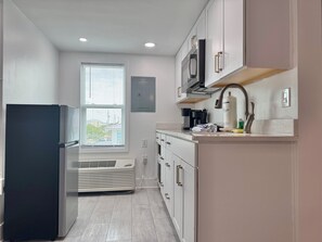 Fridge, microwave, coffee/tea maker, toaster