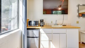 A compact kitchen with a microwave, coffee maker, and a refrigerator. - Across From Hiking Trails: Woodsy Studio! (Idyllwild)