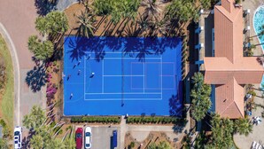 An aerial view of a residential area with a tennis court, a swimming pool, and a parking lot. - Destiny's Paradise | Lux Home, Golf Cart, Private Pool (Destin)