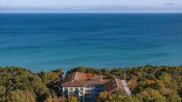 A coastal building with a view of the sea.