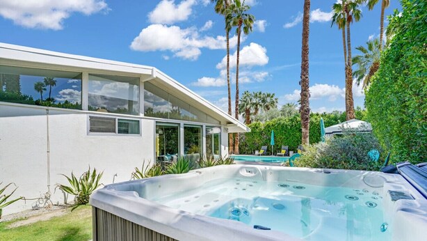 A modern house with a hot tub, a pool, and palm trees. - Twin Palms: Mid-Century Modern with Heated Pool (Palm Springs)