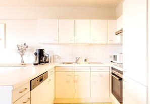 Appartement | Privékeuken | Een kinderstoel