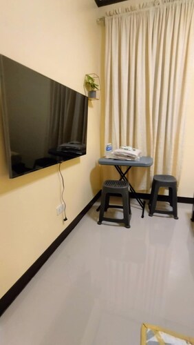 Cozy 2-bedroom lodge with WiFi, AC in charming Bagac