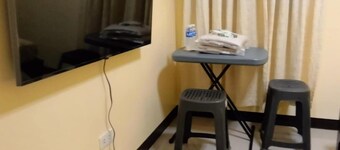 Cozy 2-bedroom lodge with WiFi, AC in charming Bagac