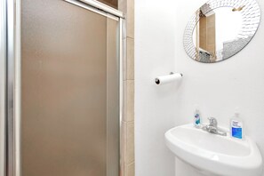 Shower, towels, soap, toilet paper
