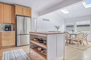 Fridge, coffee/tea maker, cookware/dishes/utensils, dining tables - Forest House Escape + Steps to McKinley Beach (Union Pier)