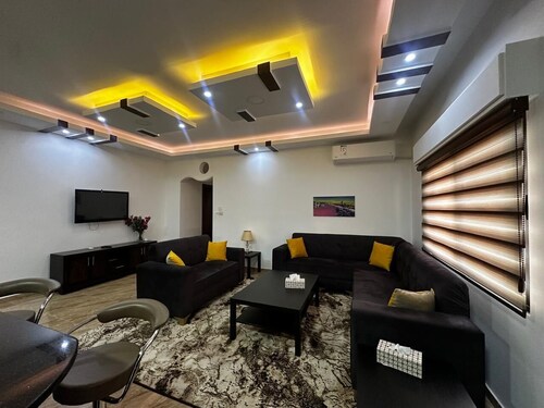 (5) 3-bedroom quiet apartment with free parking, balcony & sitting areas.