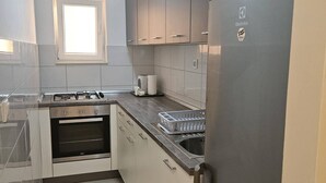 Apartment | Private kitchen - Apartment in the Coastal Town of Grebastica (Sibenik)