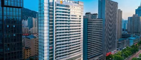 A high-rise building with multiple floors and a modern architectural design.