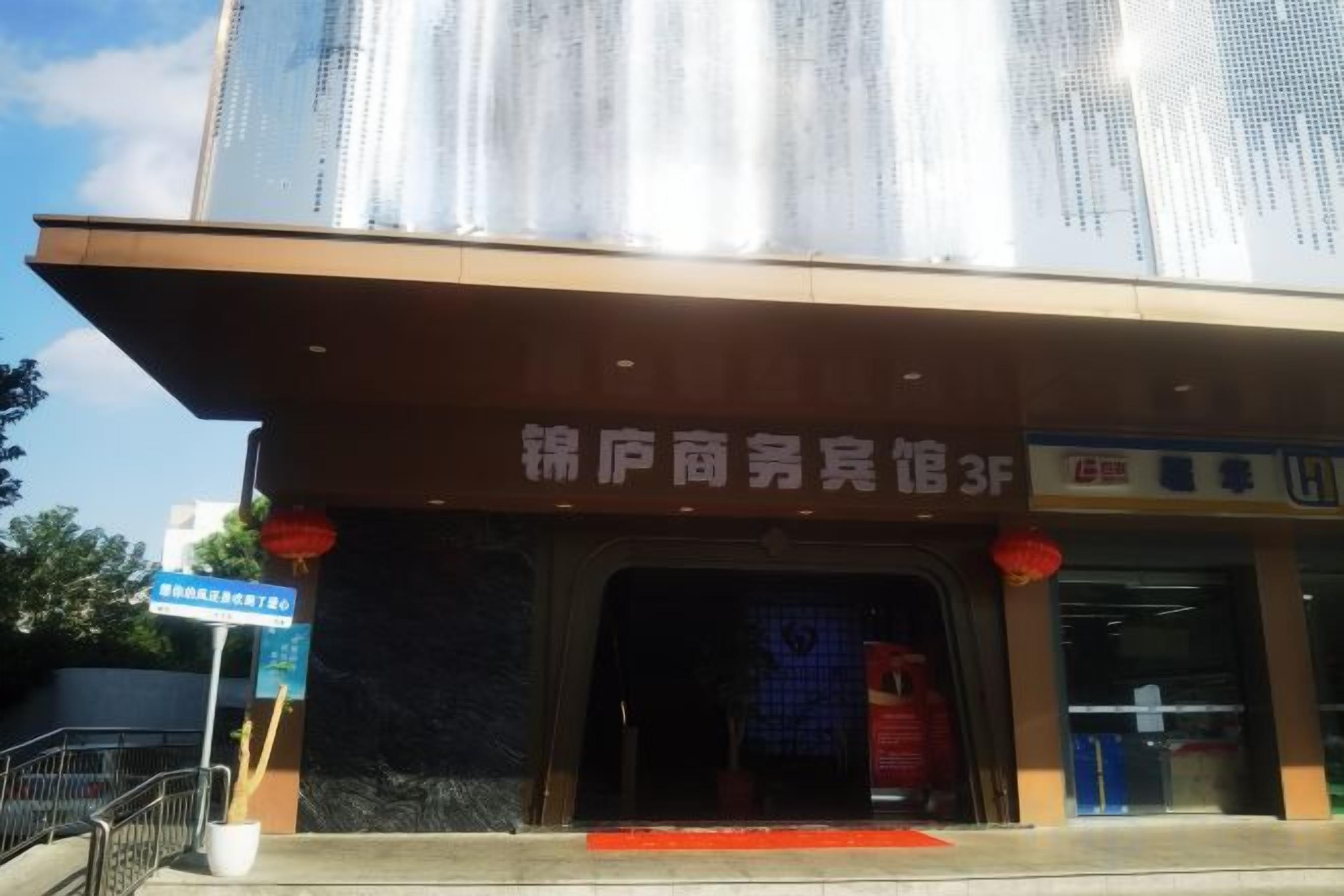 A commercial building with a storefront and a sign indicating a 3F level.