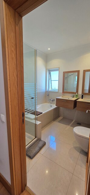Shower, hair dryer, towels, soap