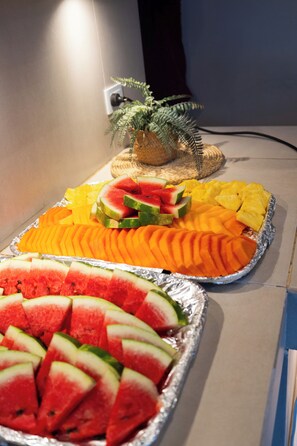 A tray of sliced fruits including watermelon, pineapple, and orange. - Hotel Rodadero Beach Blue (Santa Marta)