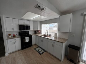 Fridge, microwave, oven, stovetop - Explore beaches & springs from this comfy 2BR—WiFi, patio, great location. (Hudson)