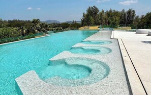 Outdoor pool, pool umbrellas, pool loungers