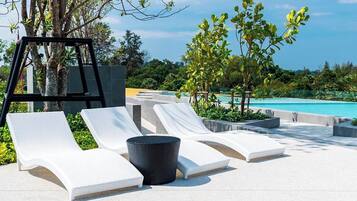 Outdoor pool, pool umbrellas, pool loungers