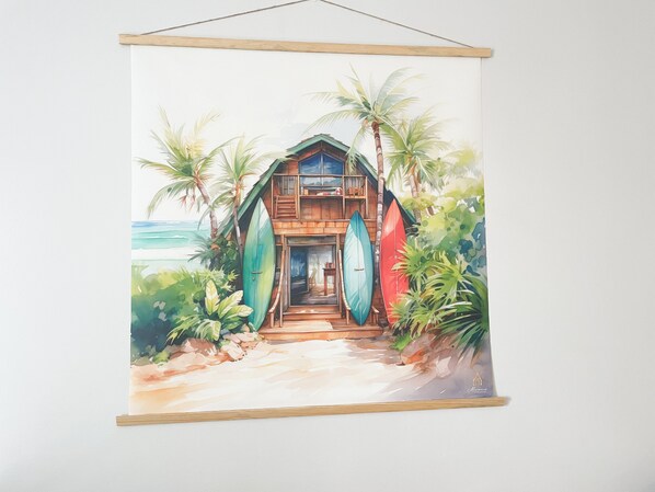A beach house with a wooden exterior, a front porch, and surfboards leaning against the house. - Apartment Papeete-Airport, Parking, wifi, AC,Pool (Papeete)