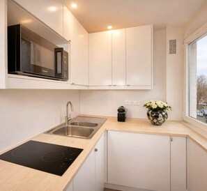 Microwave, stovetop, coffee/tea maker, toaster