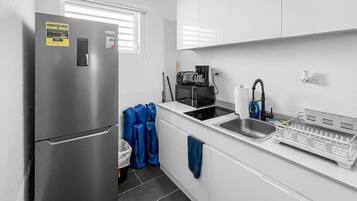 Fridge, microwave, stovetop, coffee/tea maker