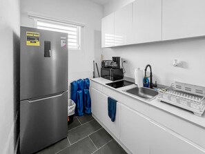 Fridge, microwave, stovetop, coffee/tea maker