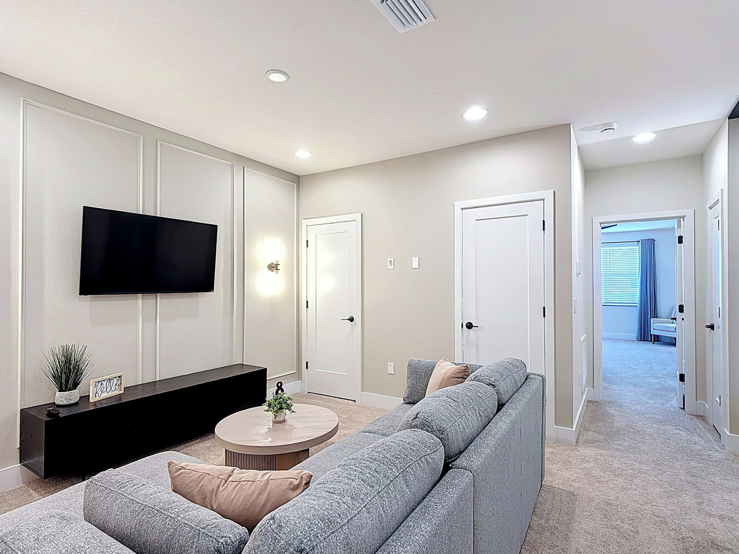 Cozy Living Space with Sectional Sofa and Mounted TV