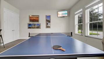 Game Room with Ping Pong Table and Wall-Mounted TV