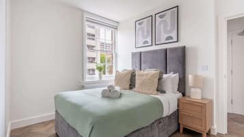 1 bedroom, desk, iron/ironing board, travel crib