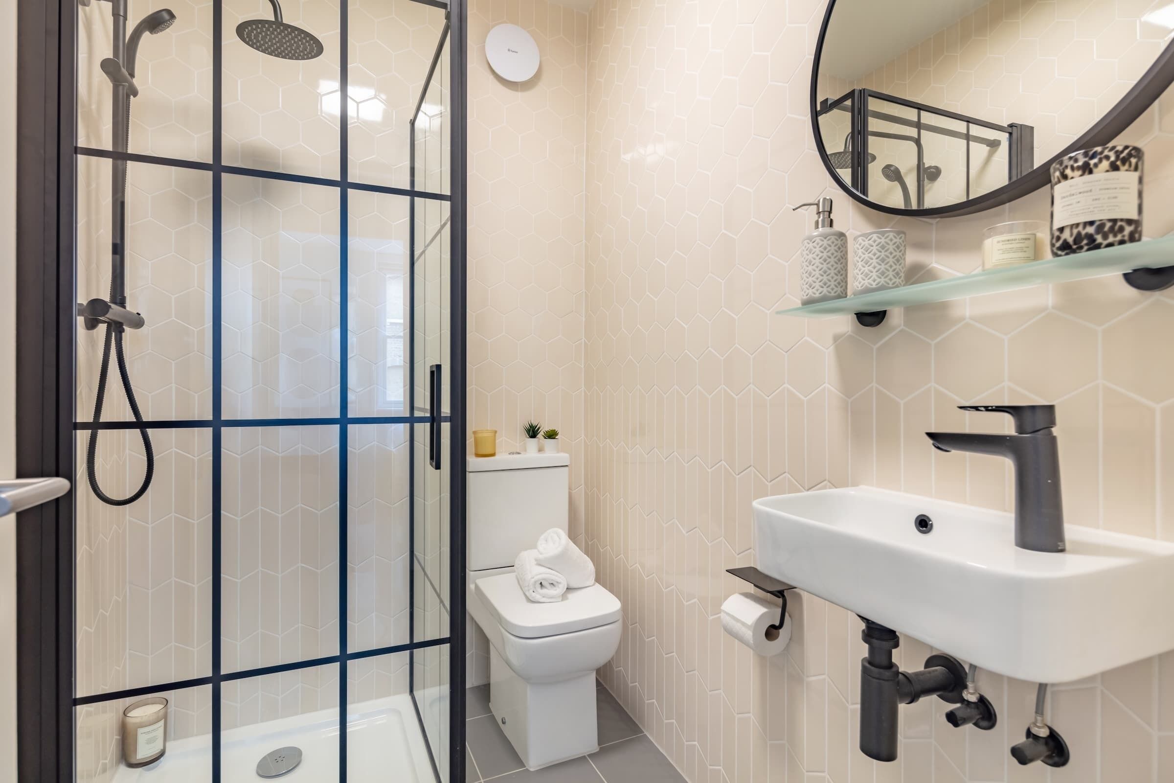 Shower, hair dryer, towels, shampoo