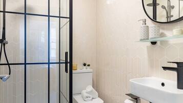 Shower, hair dryer, towels, soap