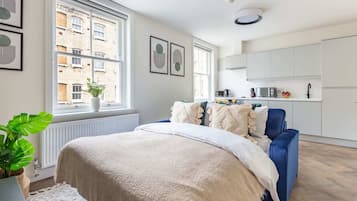 1 bedroom, desk, iron/ironing board, travel crib