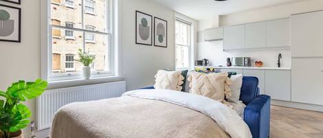 1 bedroom, desk, iron/ironing board, travel crib