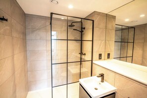 Shower, hair dryer, towels, shampoo
