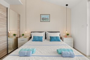 3 habitaciones, tabla de planchar con plancha y cuna de viaje 