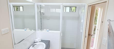 Shower, towels, soap, toilet paper