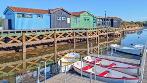A waterfront property with a dock and several boats.
